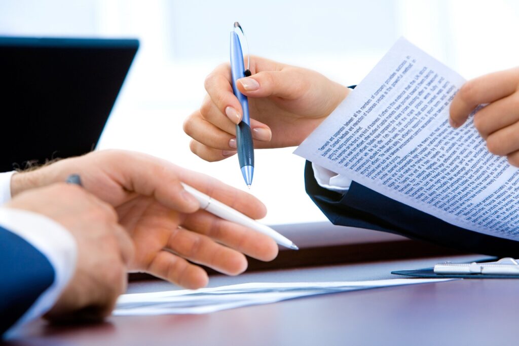Business partners signing an office lease agreement